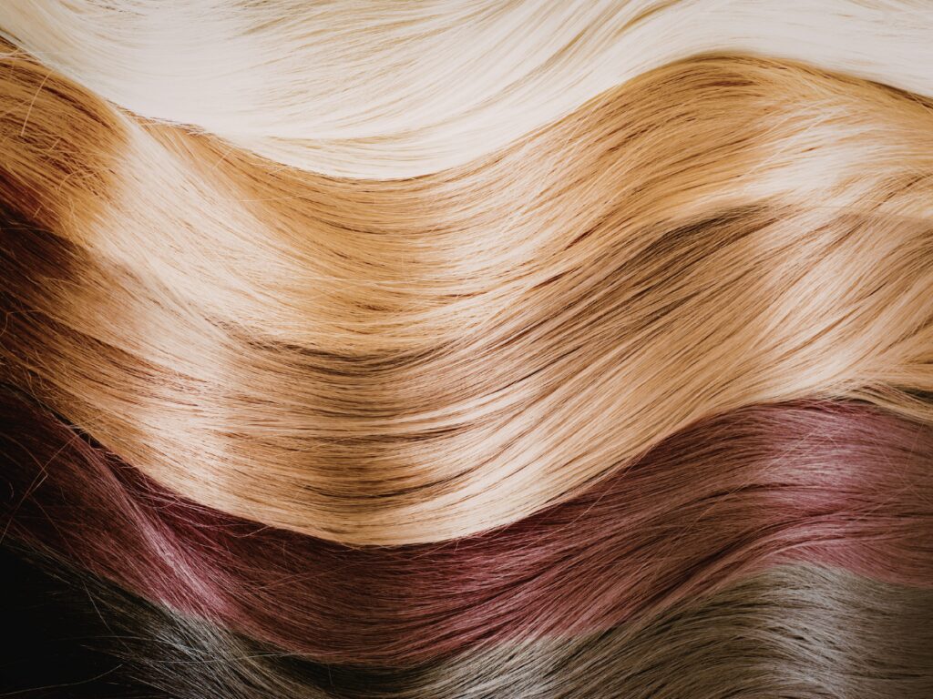 Close-up multicolored hair strands arranged in waves
