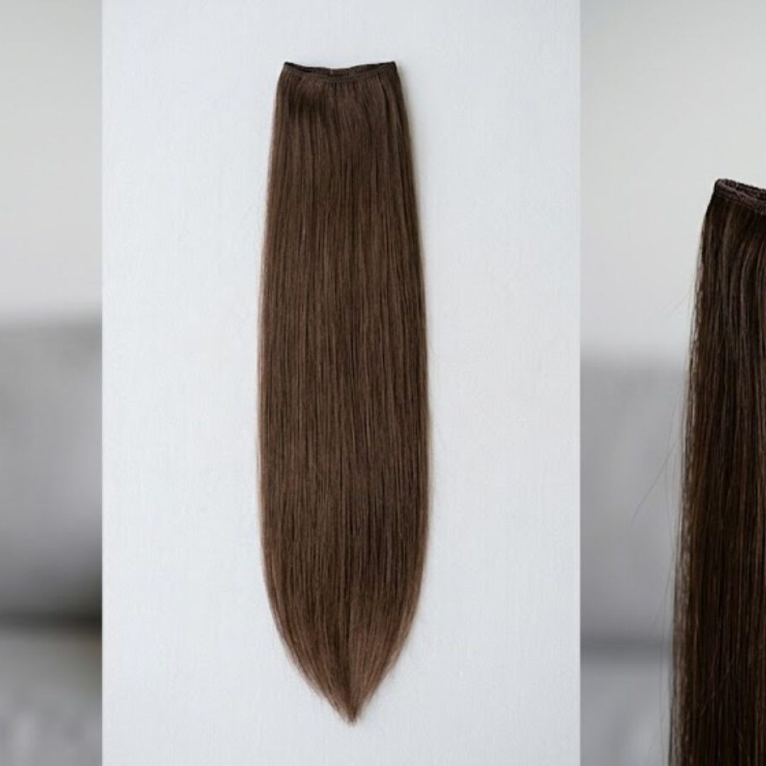 Long straight brown hair extension against white